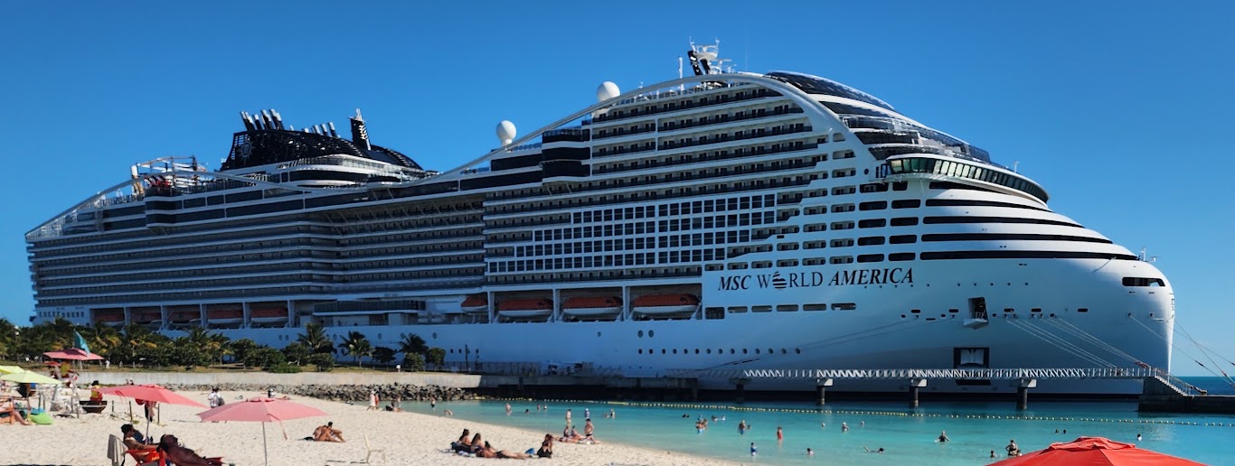 MSC World America docked beside the beach