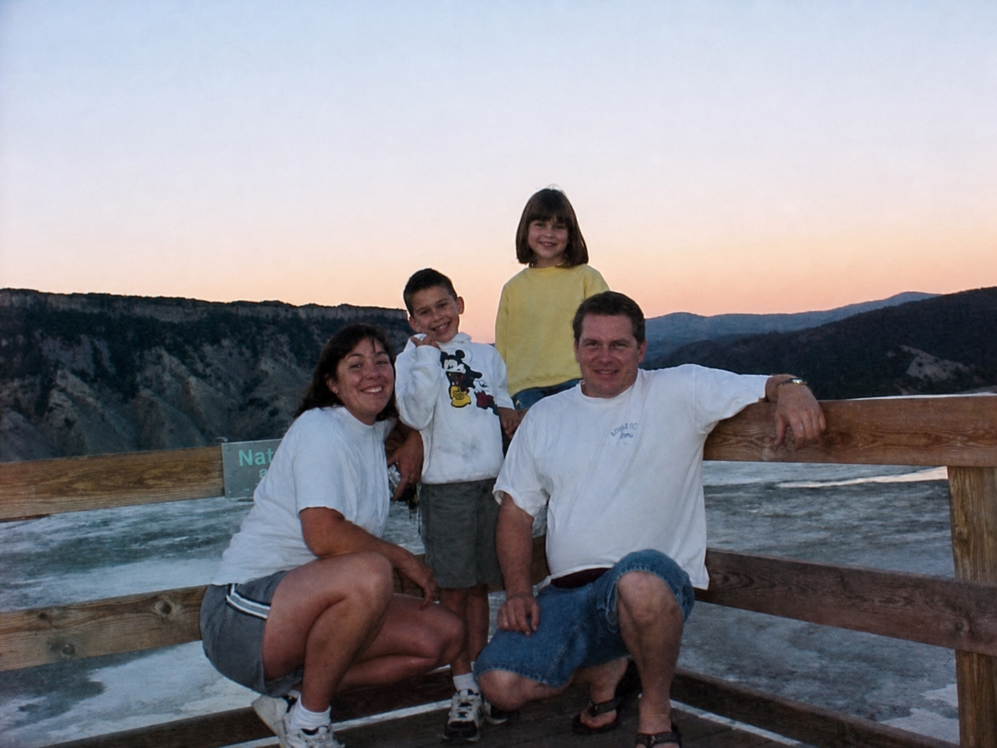 Ron, Michelle, and their children together at a scenic mountain overlook